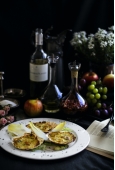 Capesante gratinate ripiene con gamberi, cozze e calamari in delicata salsa al profumo di zafferano